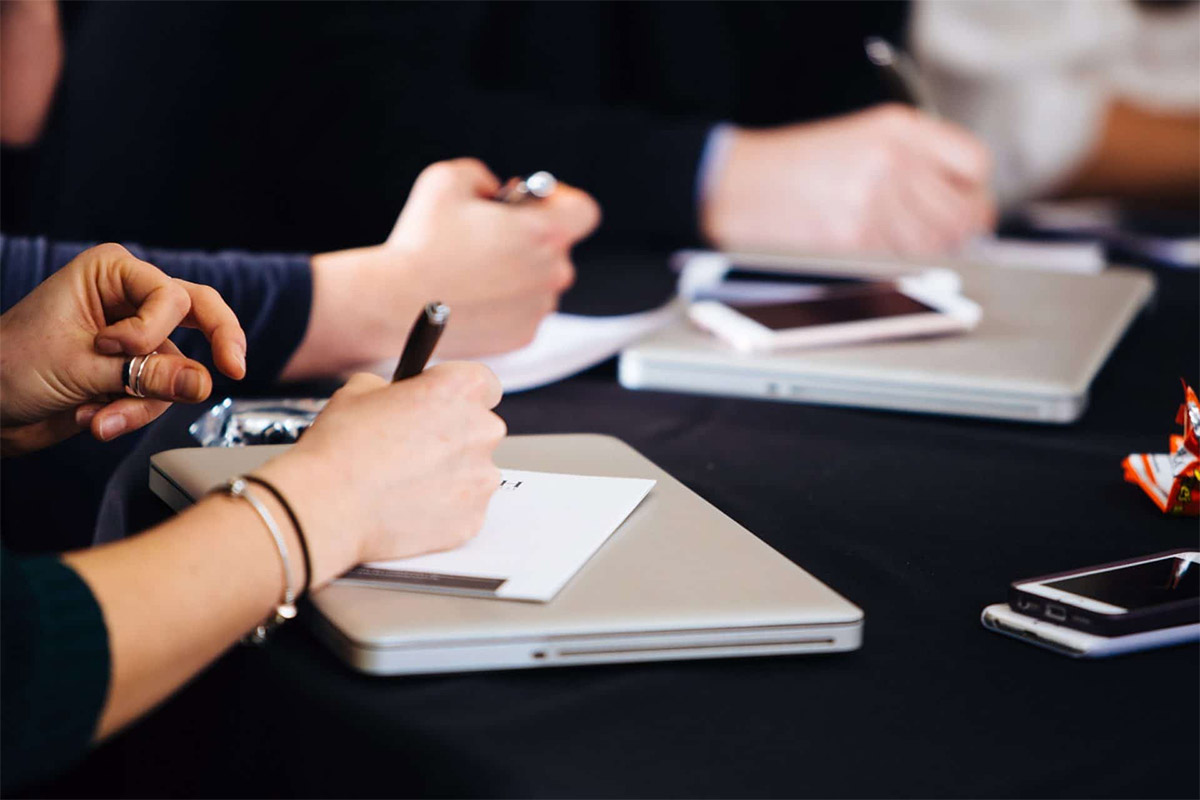 Group Of People Taking Notes