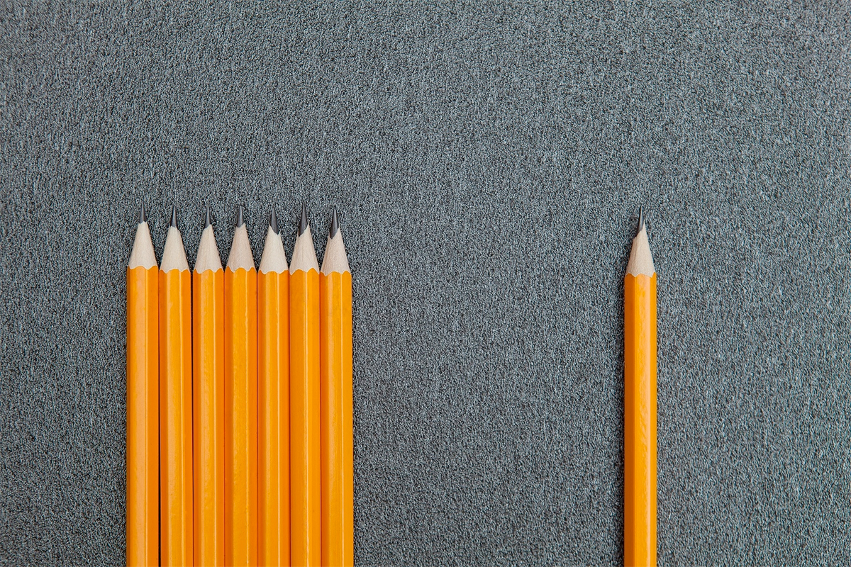 Orange Pencils On grey Background