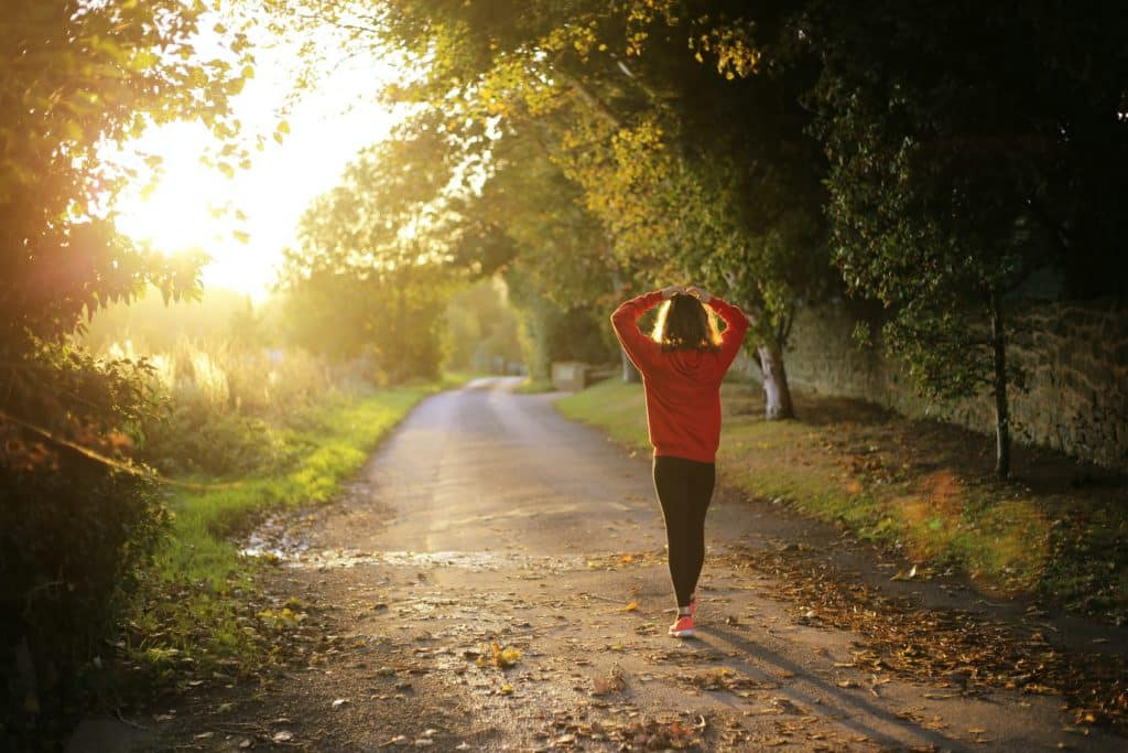 Lady Walking Down A Country Lane
