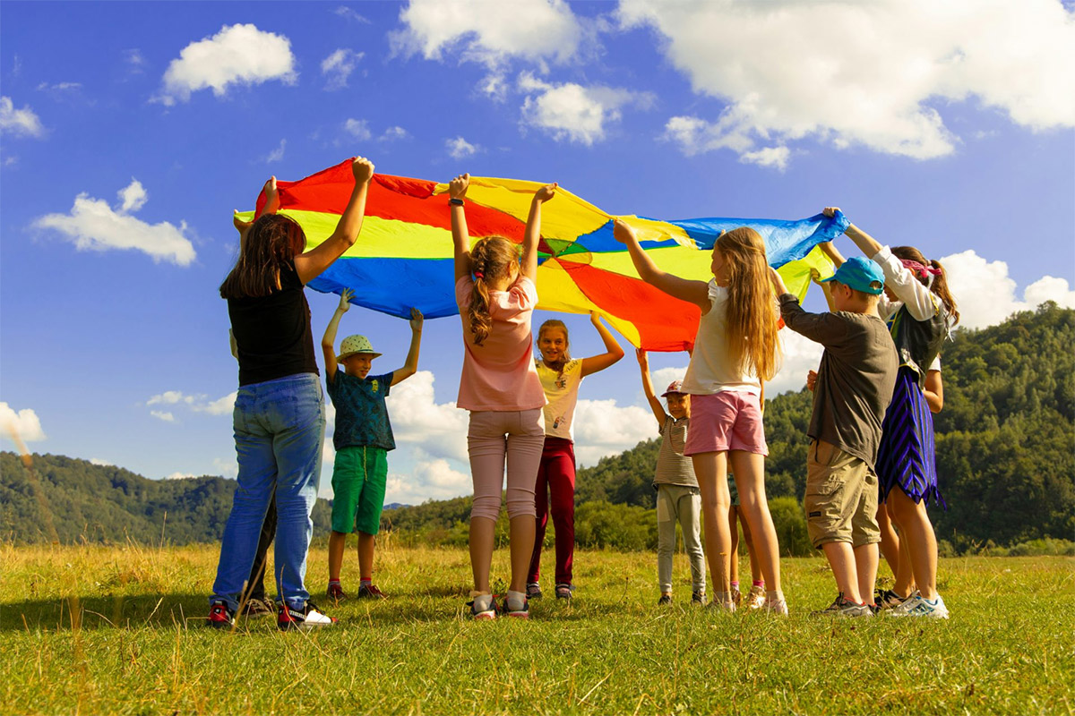 Group Of Children Playing In A Field