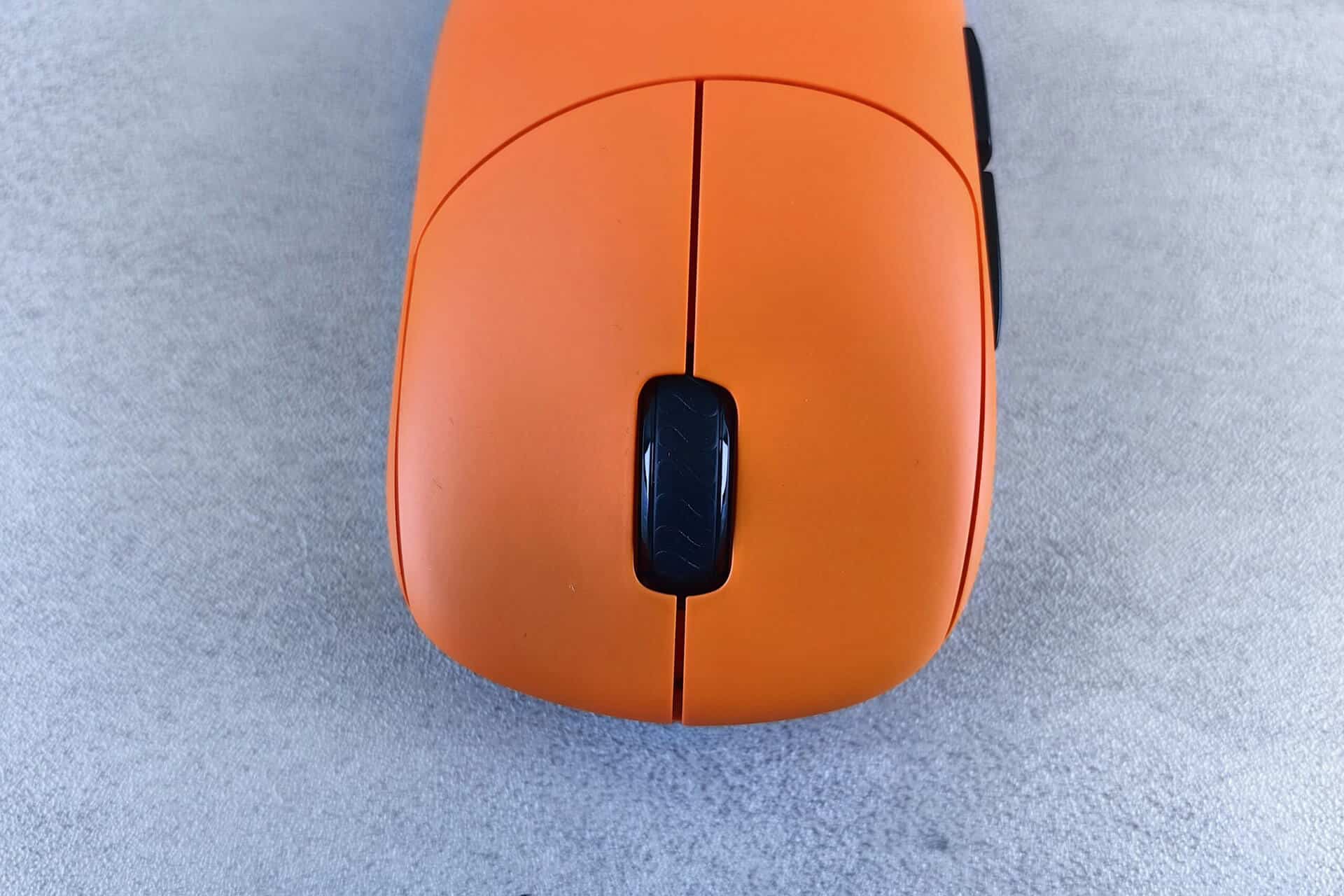 Orange mouse on grey background - charity IT project management