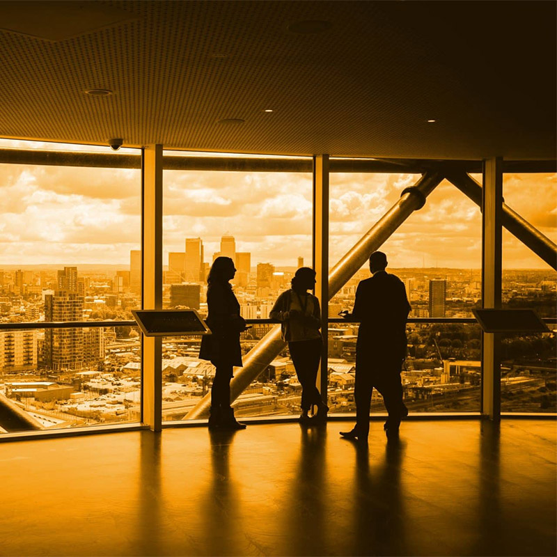 Silhouetted Business People With Orange Hue