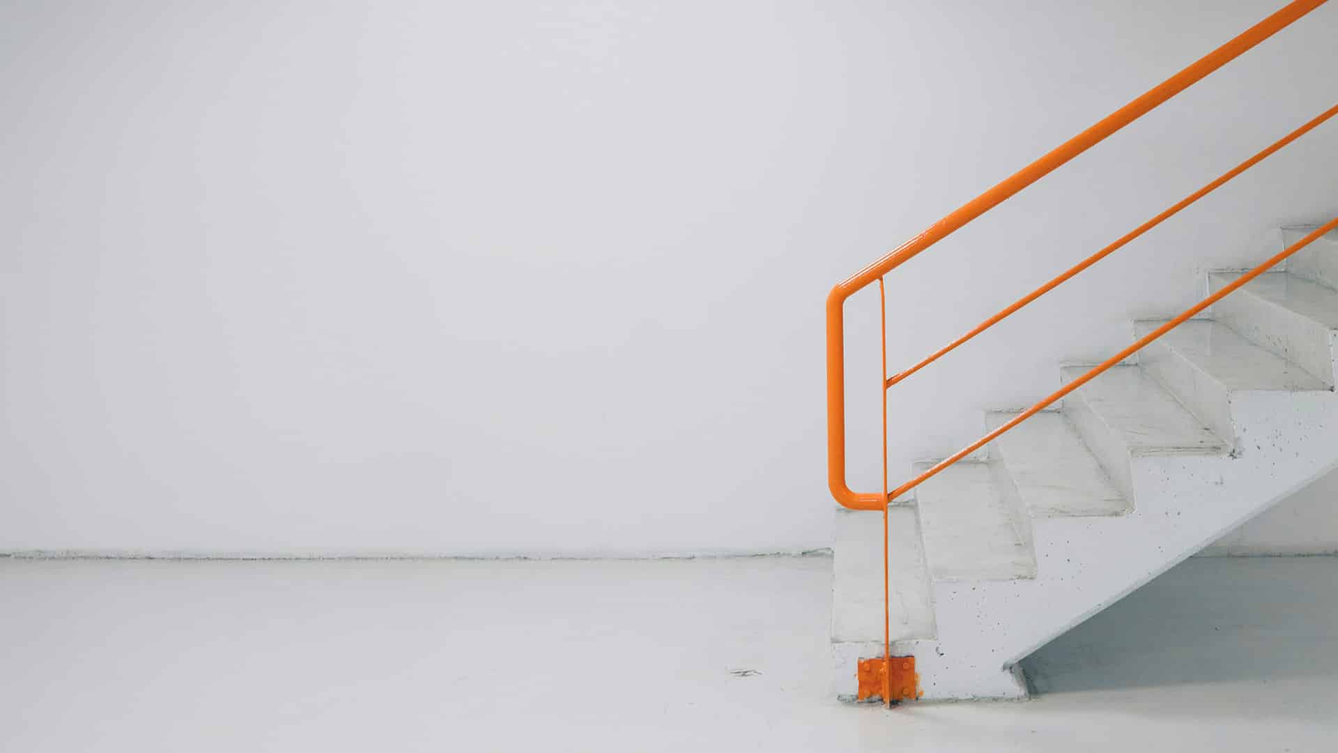 Stairs With Orange Railings
