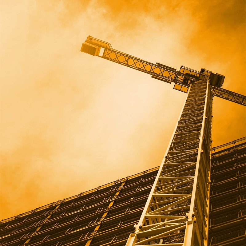 View of Crane From Bottom Up With Orange Hue